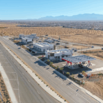Adelanto Towne Center retail property exterior with parking and signage